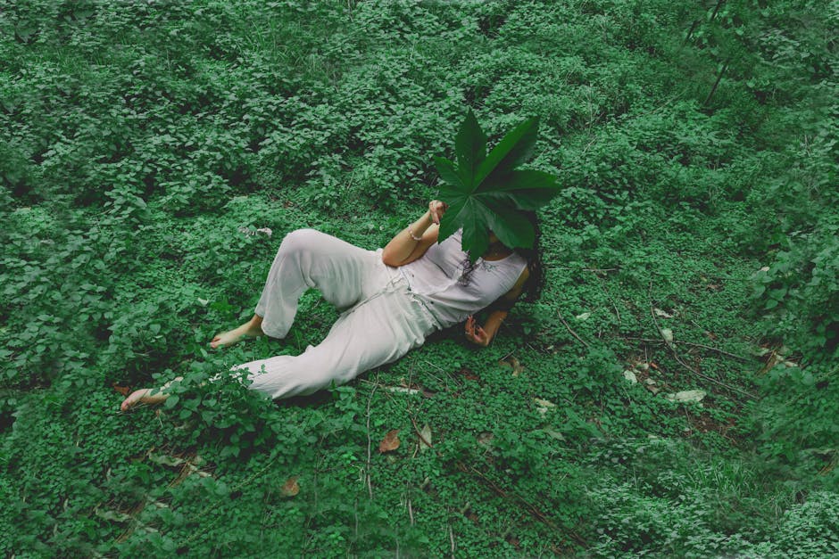 A person lying in the grass symbolizing stress-free support